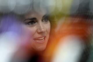 Kate, Princess of Wales, seen in focus surrounded by blurred pigments at an event in North London