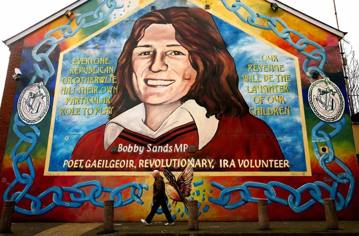 A man walks past a Bobby Sands mural in Belfast. Sands was the first of the IRA prisoners refusing food to die in the 1981 hunger strike in Northern Ireland.