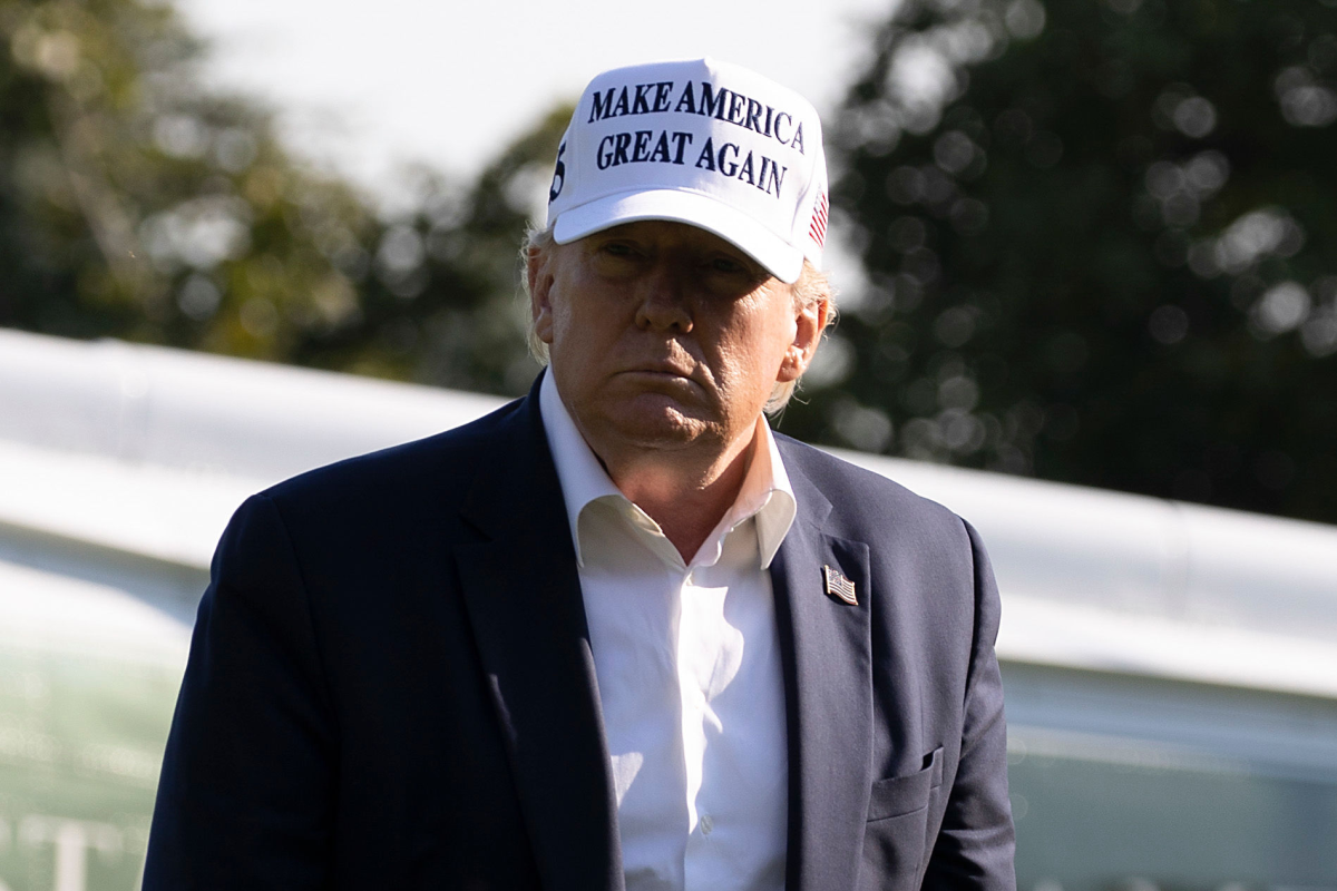 President Trump walks off Marine One on the South Lawn of the White House in July.