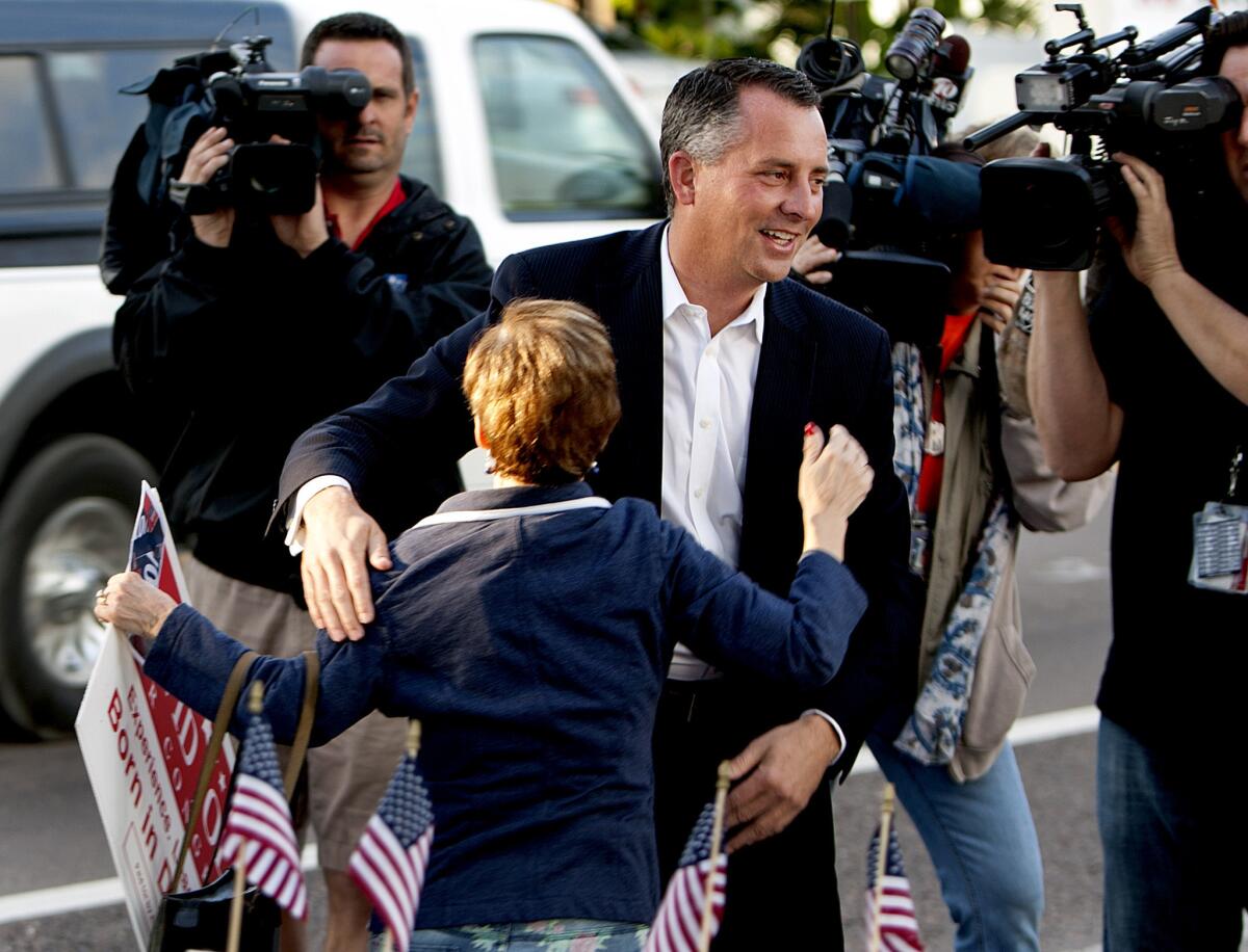 Candidate David Jolly greets supporters as he arrives at the Indian Shores Town Hall to place his vote in the special election for Florida 13th Congressional District.