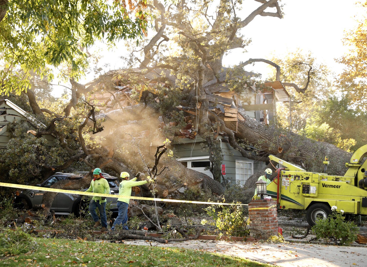 1 dead, 2 rescued after 100,000-pound oak tree smashes into Encino home 