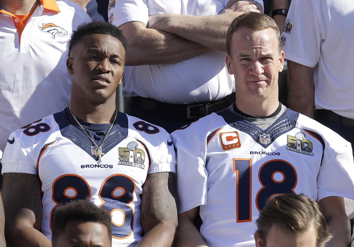 Denver Broncos wide receiver Demaryius Thomas, left, and quarterback Peyton Manning pose for team photos.