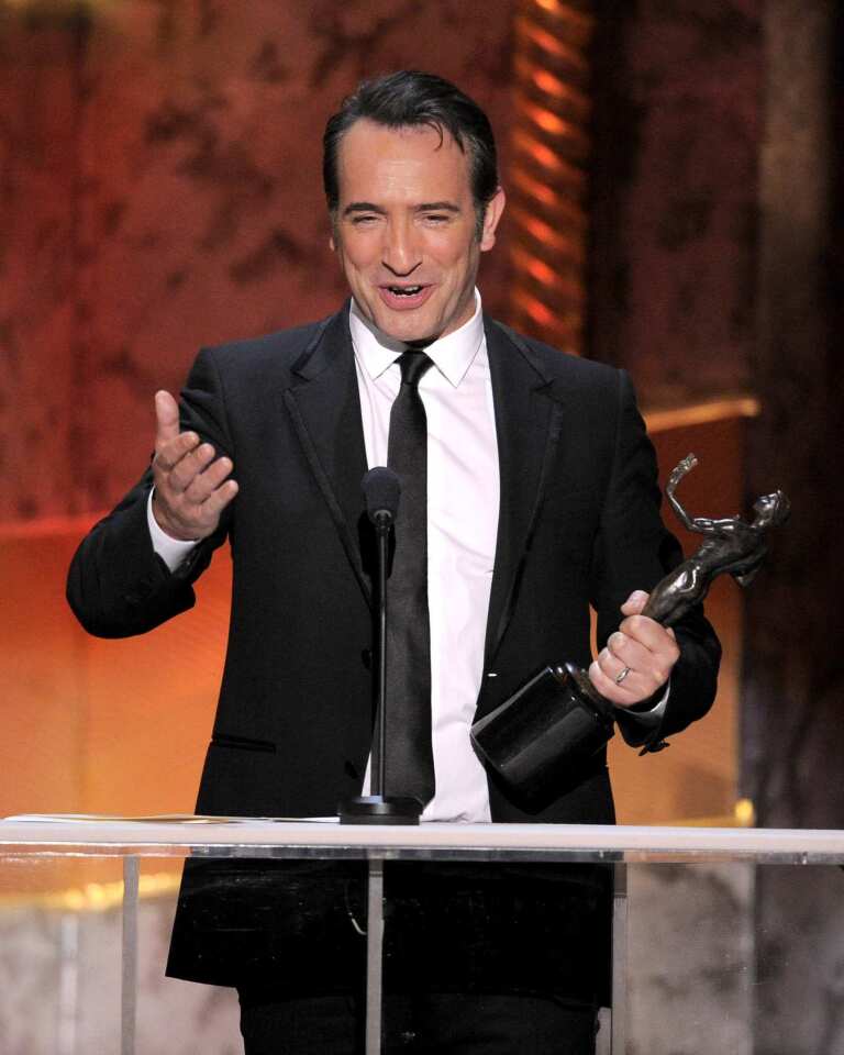 Jean Dujardin accepts the award for outstanding performance by a male actor in a leading role for the film "The Artist."