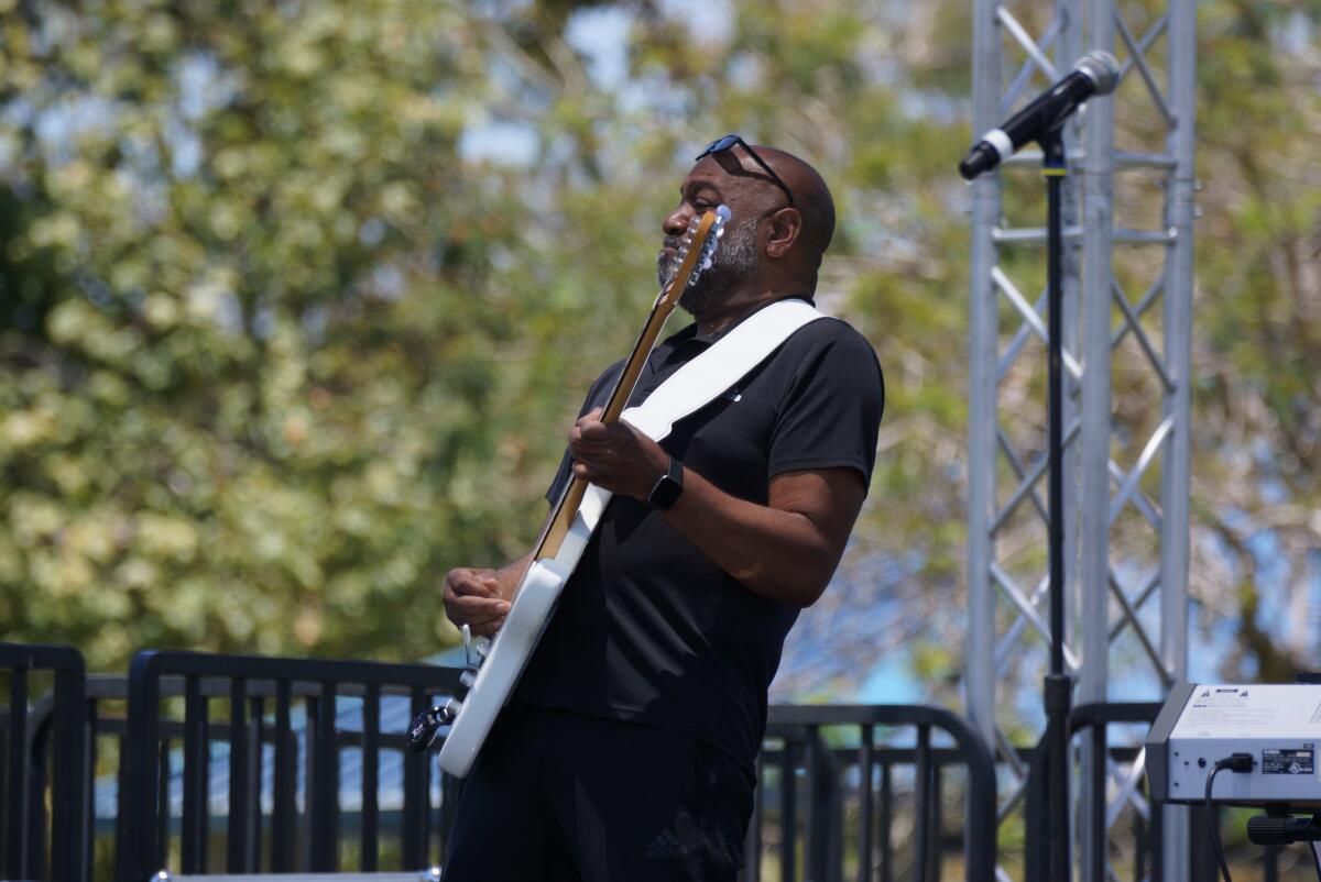 A man plays the guitar. Live performances are planned for Santa Ana’s Juneteenth Festival.