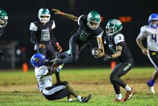 Ja'Marion Broughton of Dorsey goes airborne against Crenshaw.