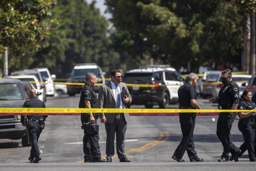KOREATOWN, CA - JUNE 02: LAPD investigate a possible scene from a shooting in Koreatown near the corner of 8th Street and South Berendo Street. at on Thursday, June 2, 2022 in Koreatown, CA. (Francine Orr / Los Angeles Times)