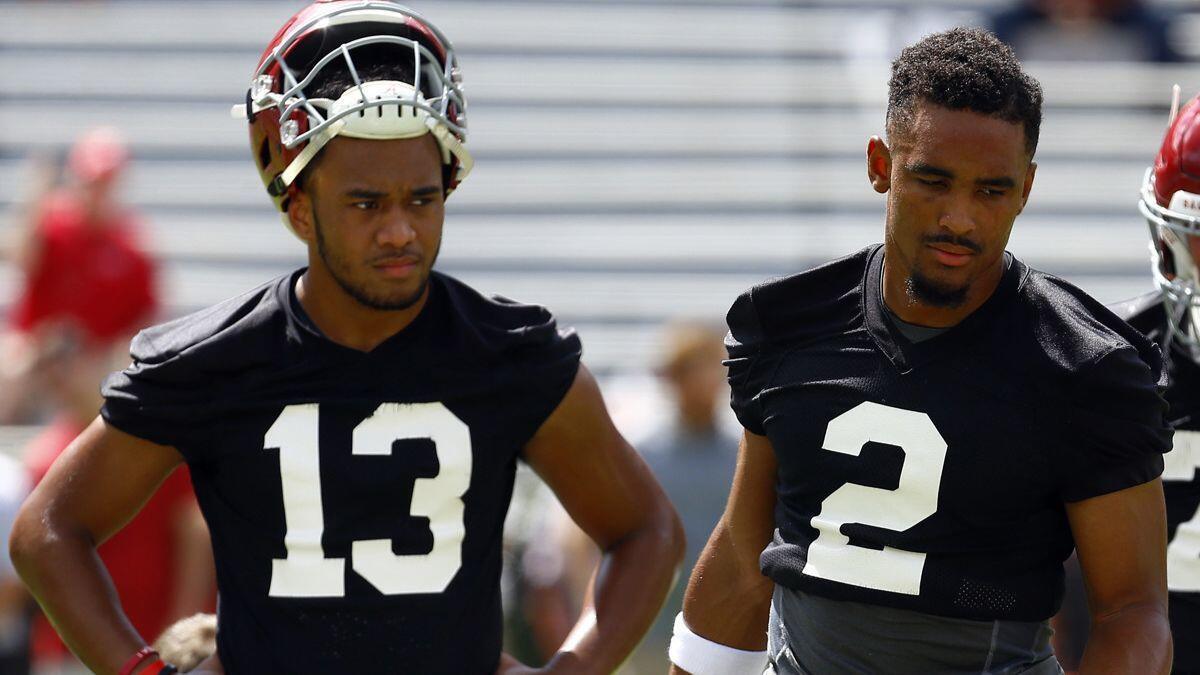 Alabama quarterbacks Tua Tagovailoa (13) and Jalen Hurts (2) take part in practice in Tuscaloosa, Ala. Alabama coach Nick Saban enters game week with the two listed as co-starters against Louisville.