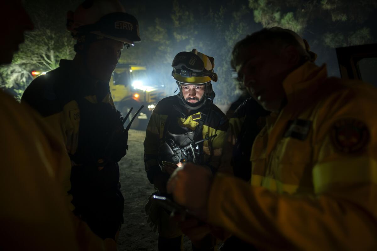 Firefighters working at night