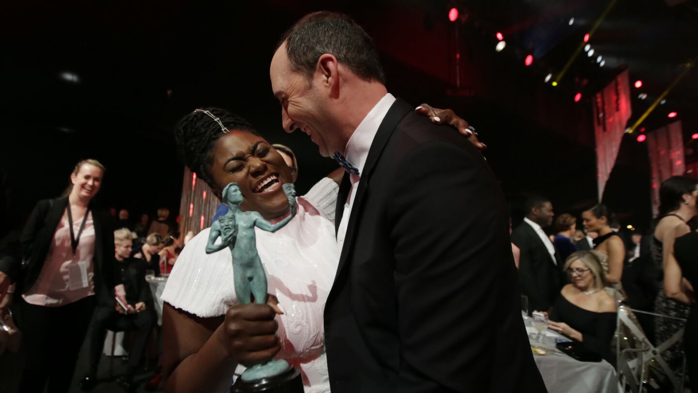 Actress Danielle Brooks receives a hug from Tony Hale after winning Outstanding Performance by an Ensemble in a Comedy Series.