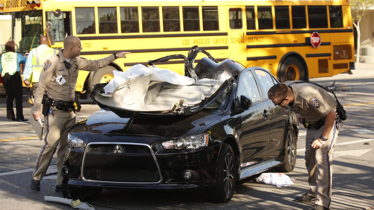 Two people were sent to the hospital in critical condition Thursday morning after their car collided with a Los Angeles Unified school bus in Watts.