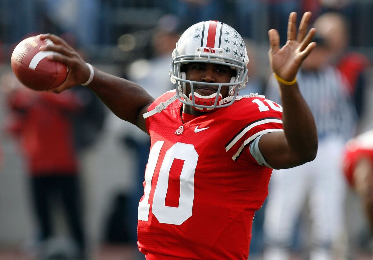 Heisman Trophy winner Troy Smith (10) warms up before Ohio State's game against rival Michigan on Nov. 18, 2006.