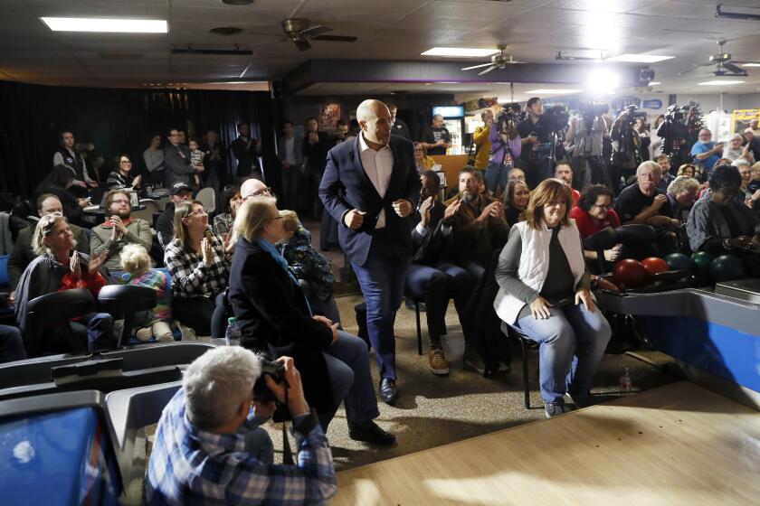 Democratic presidential candidate Sen. Cory Booker, D-N.J., arrives at a meet and greet at the Adel Family Fun Center, Friday, Dec. 20, 2019, in Adel, Iowa. (AP Photo/Charlie Neibergall)