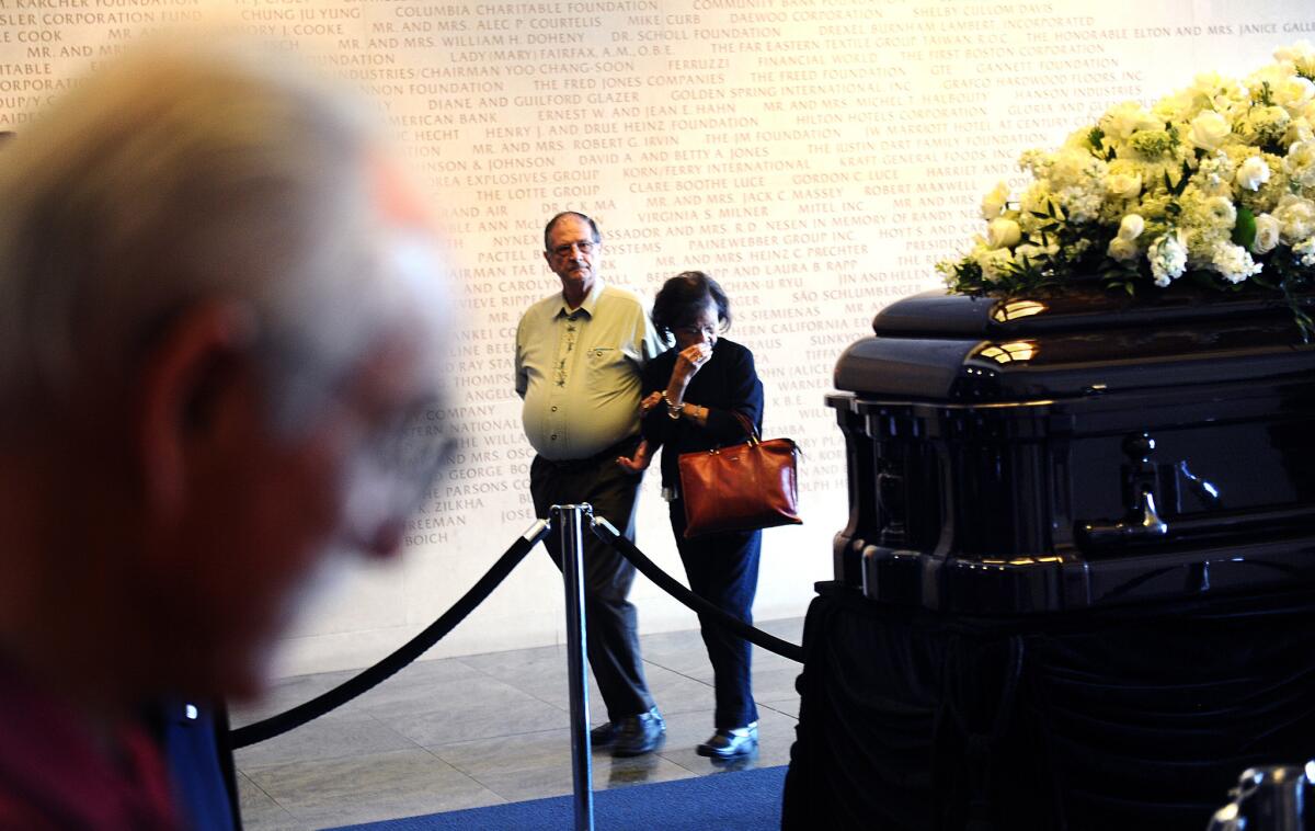 People come to pay their respects in front of the casket of former first lady Nancy Reagan during a lying in repose at the Reagan Presidential Library on Wednesday, March 9.