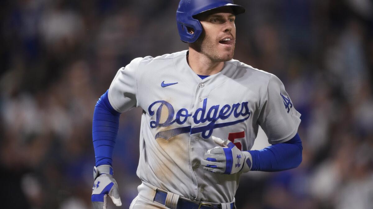 Dodgers lose to Astros in extra innings as Freddie Freeman reaches