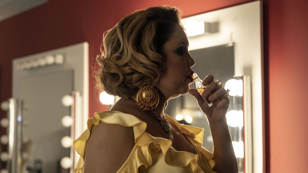 Isabel Torres taking a shot as modern-day Cristina Ortiz Rodríguez, la Veneno.