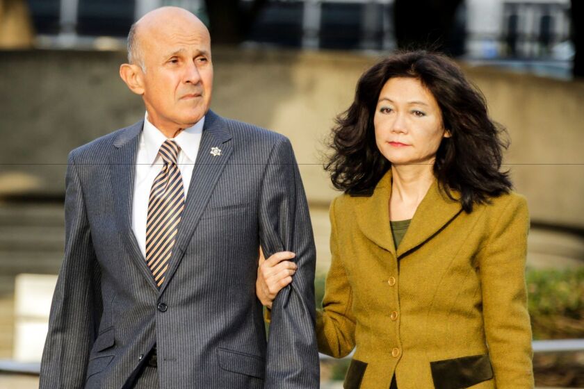 Former Los Angeles County Sheriff Lee Baca and wife, Carol Chiang, arrive at federal court earlier this month for his trial. Baca faces obstruction of justice and conspiracy charges.