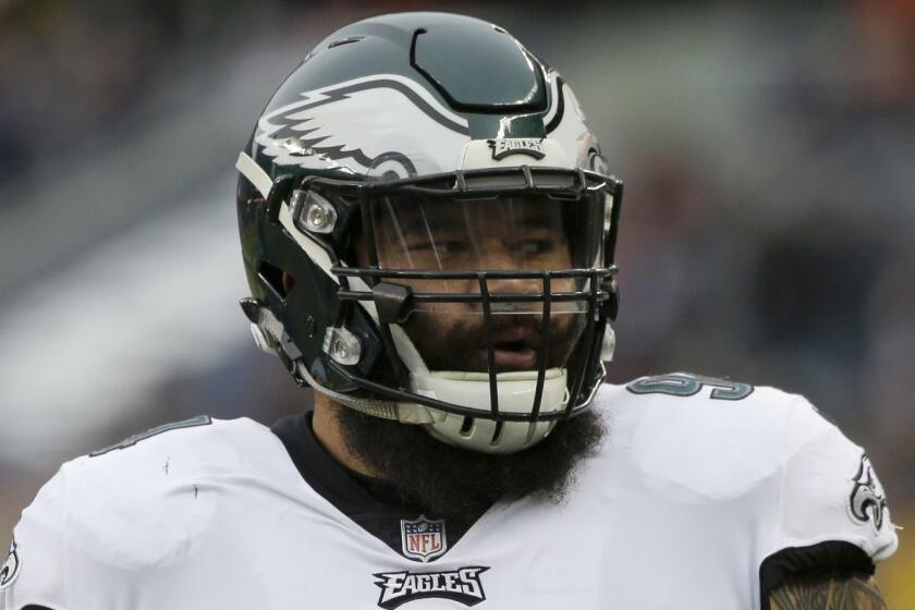 Philadelphia Eagles defensive tackle Haloti Ngata (94) warms up before an NFL wild-card playoff football game Sunday, Jan. 6, 2019, in Chicago. (AP Photo/David Banks)