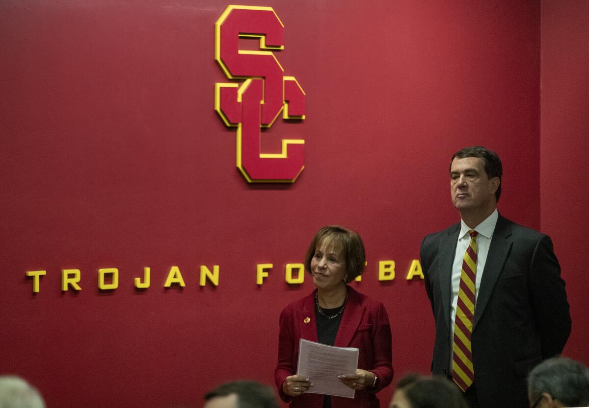 USC President Carol L. Folt waits with new USC athletic director Mike Bohn during news conference on Nov. 7.