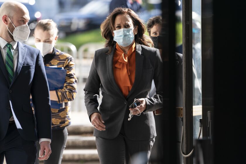 Democratic vice presidential candidate Sen. Kamala Harris, D-Calif., arrives on Capitol Hill for the confirmation hearing of Supreme Court nominee Amy Coney Barrett before the Senate Judiciary Committee, Tuesday, Oct. 13, 2020, on Capitol Hill in Washington. (AP Photo/Jacquelyn Martin)