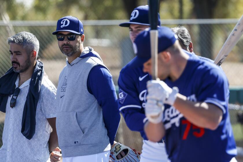 Former Dodgers outfielder Andre Ethier, second from left, watches drills during spring training.