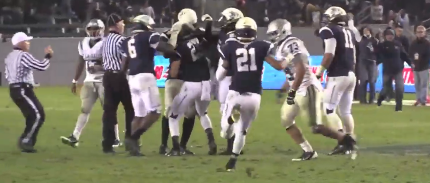 St. John Bosco players congratulate Gavin Windes, center, after his interception against Concord De La Salle in the 2013 CIF state championship Open Division bowl game clinched the Braves' 20-14 victory.