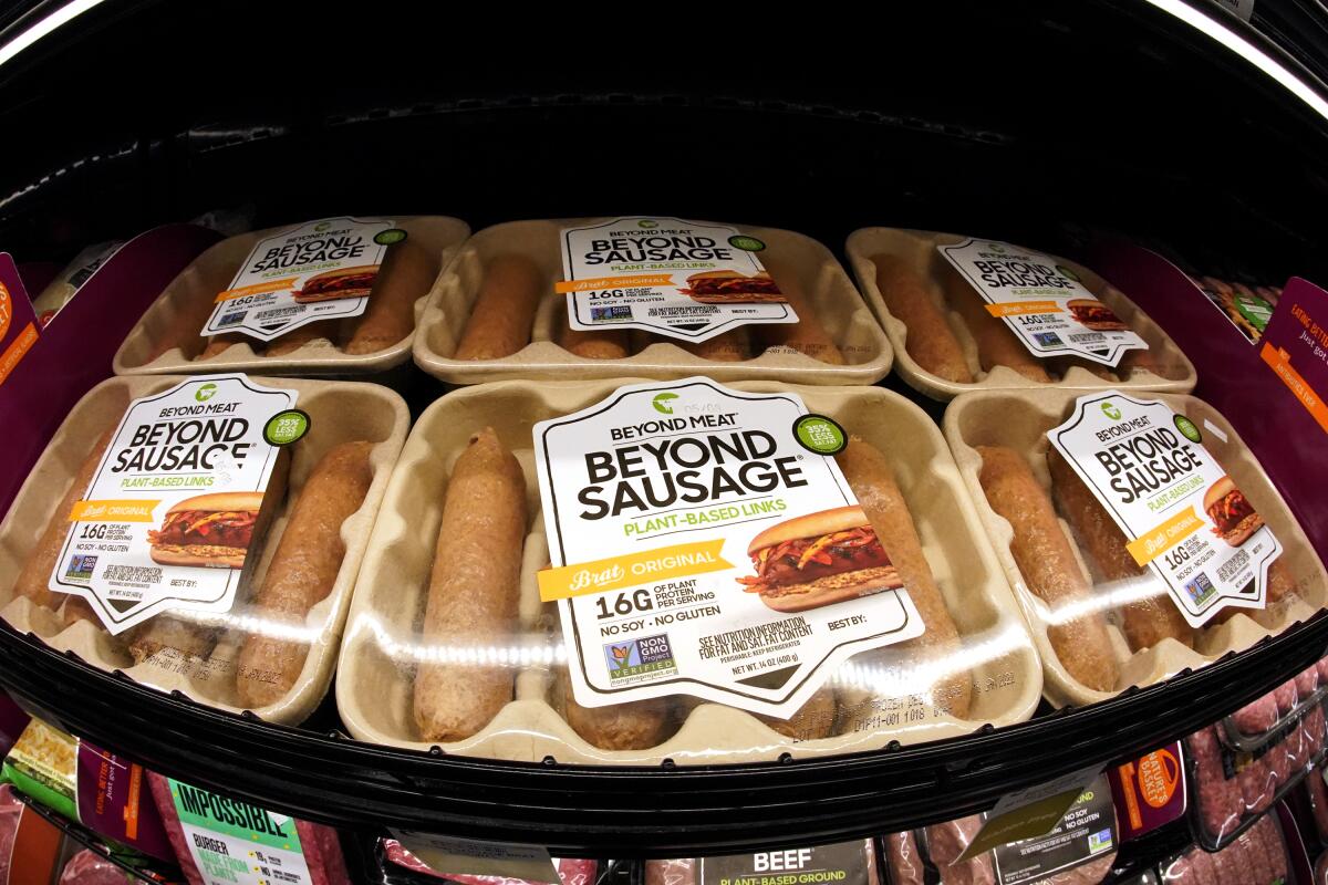 FILE - Beyond Meat brand Beyond Sausage are displayed in a cooler in a market in Pittsburgh, Wednesday, May 5, 2021. Plant-based meat maker Beyond Meat reported lower-than-expected sales in the third quarter due to a slump in U.S. demand (AP Photo/Gene J. Puskar, File)