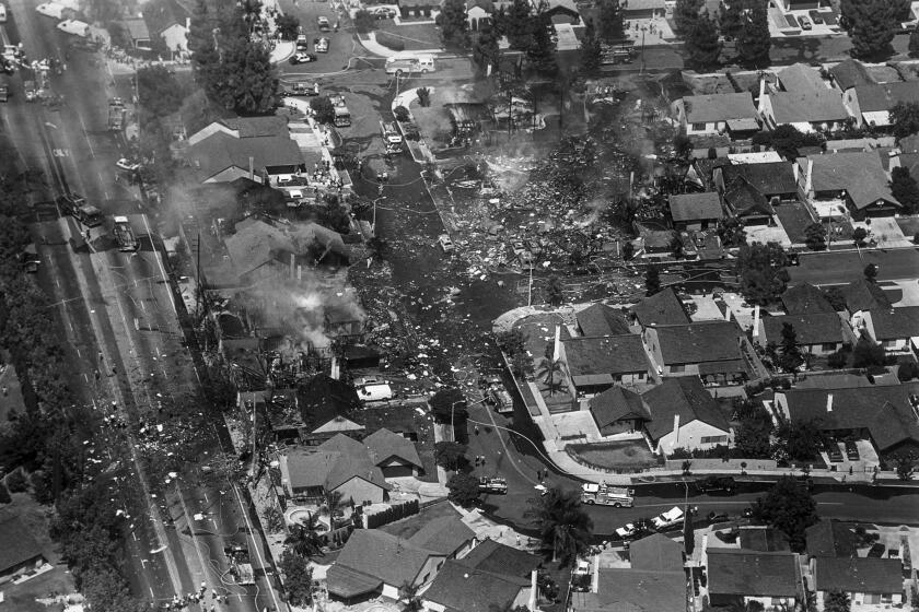 Aug. 31, 1986: Debris and smolding ruins of homes mark the area of Cerritos where Aeromexico jetliner fell to earth. Carmenta Road is at the left and Ashworth Place at the top..