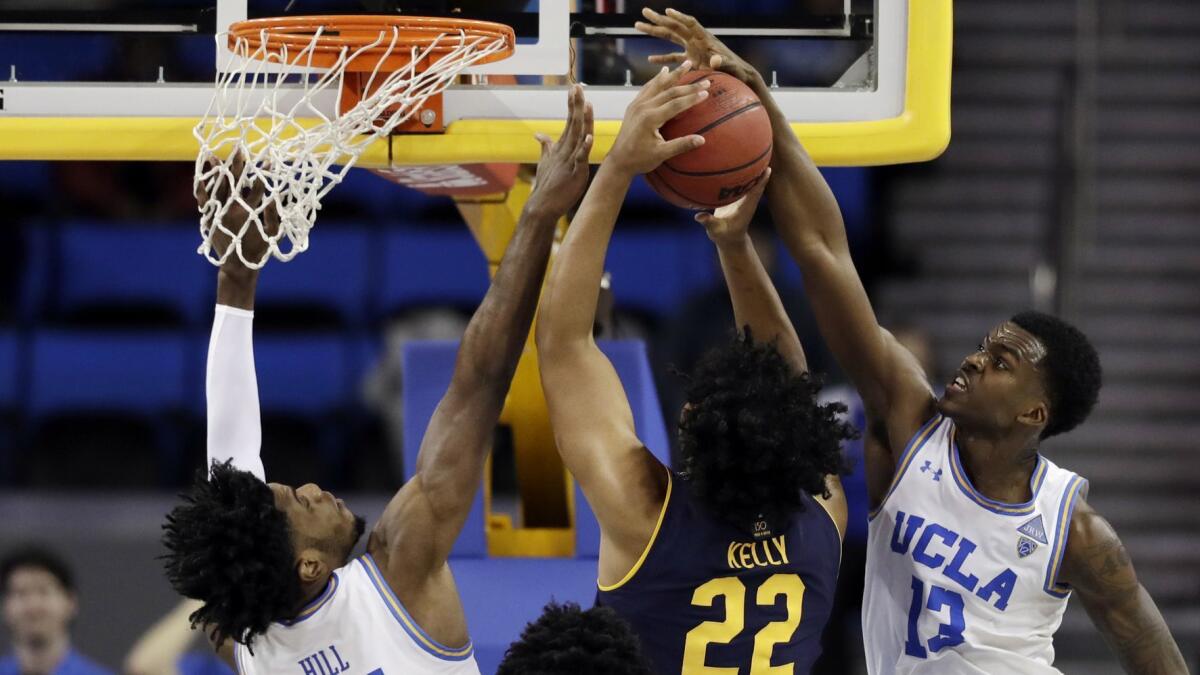 UCLA guard Kris Wilkes (13) blocks a shot by California forward Andre Kelly during the second half Saturday.