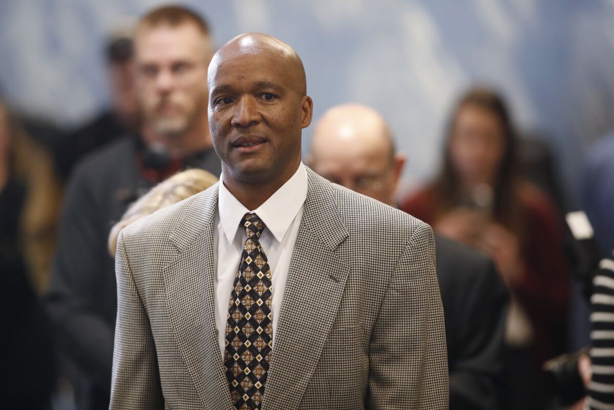 FILE - In this Feb. 24, 2020, file photo, Karl Dorrell enters a news conference after he was named football coach at Colorado, in Boulder, Colo. Dorrell starts his stint as Colorado coach by facing UCLA, where he played in the 1980s and served as coach from 2003 to 2007. (AP Photo/David Zalubowski, File)