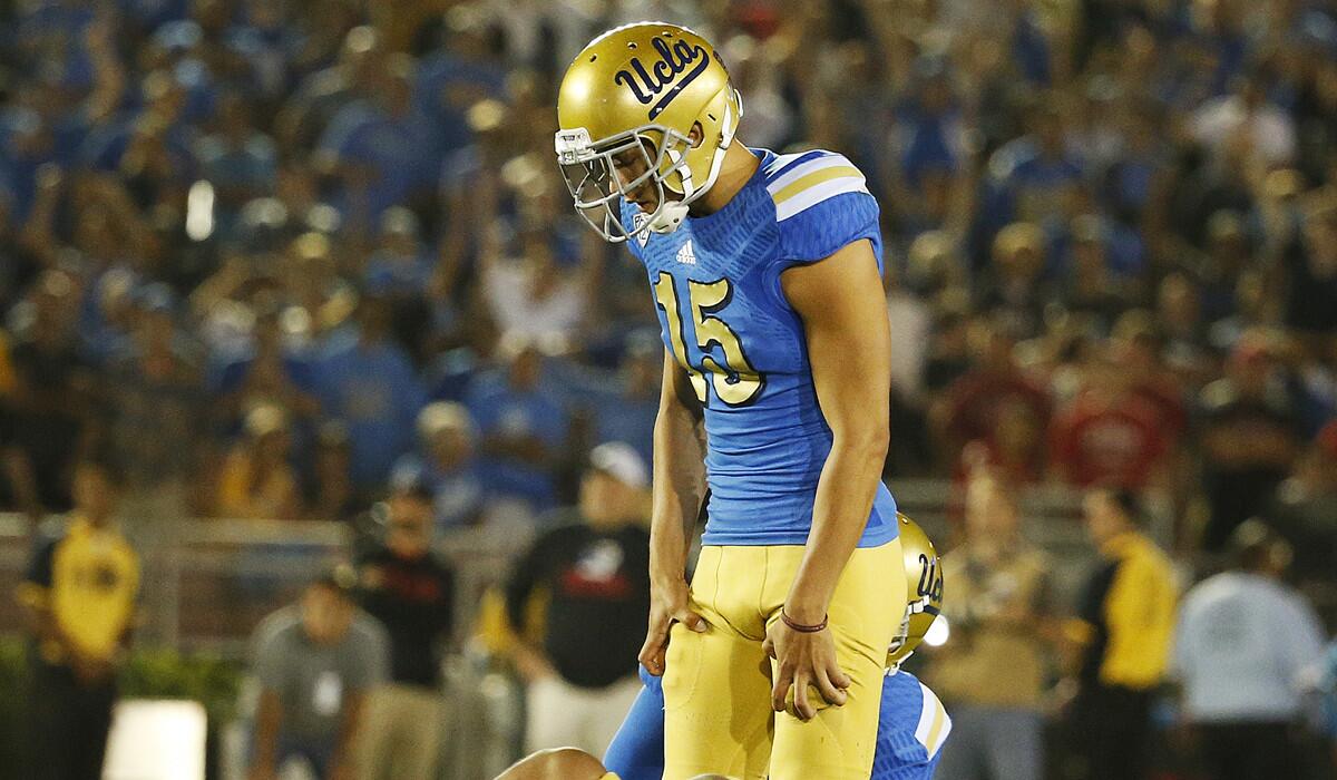 UCLA kicker Ka'imi Fairbairn stares at the ground after missing a 50-yard field goal on the final play of the game Saturday against Utah.