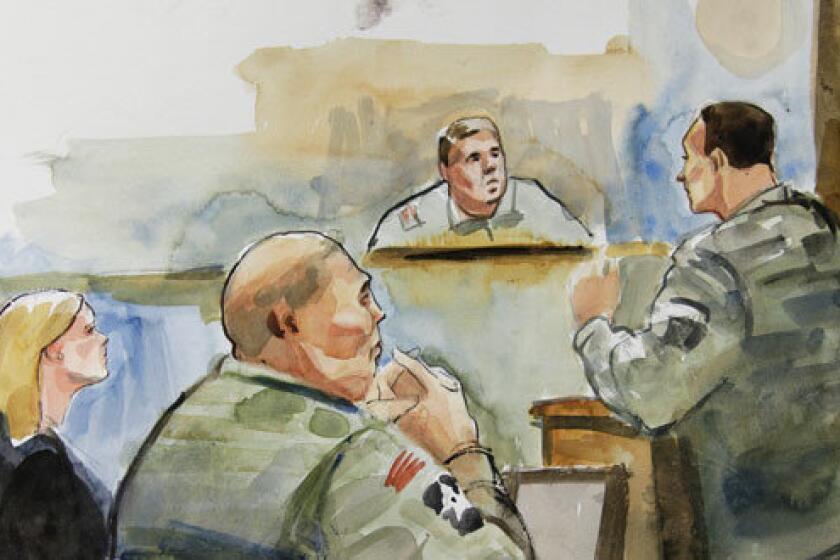 In this courtroom sketch, U.S. Army Staff Sgt. Robert Bales, second from left, sits next to Emma Scanlan, left, one of his civilian attorneys.