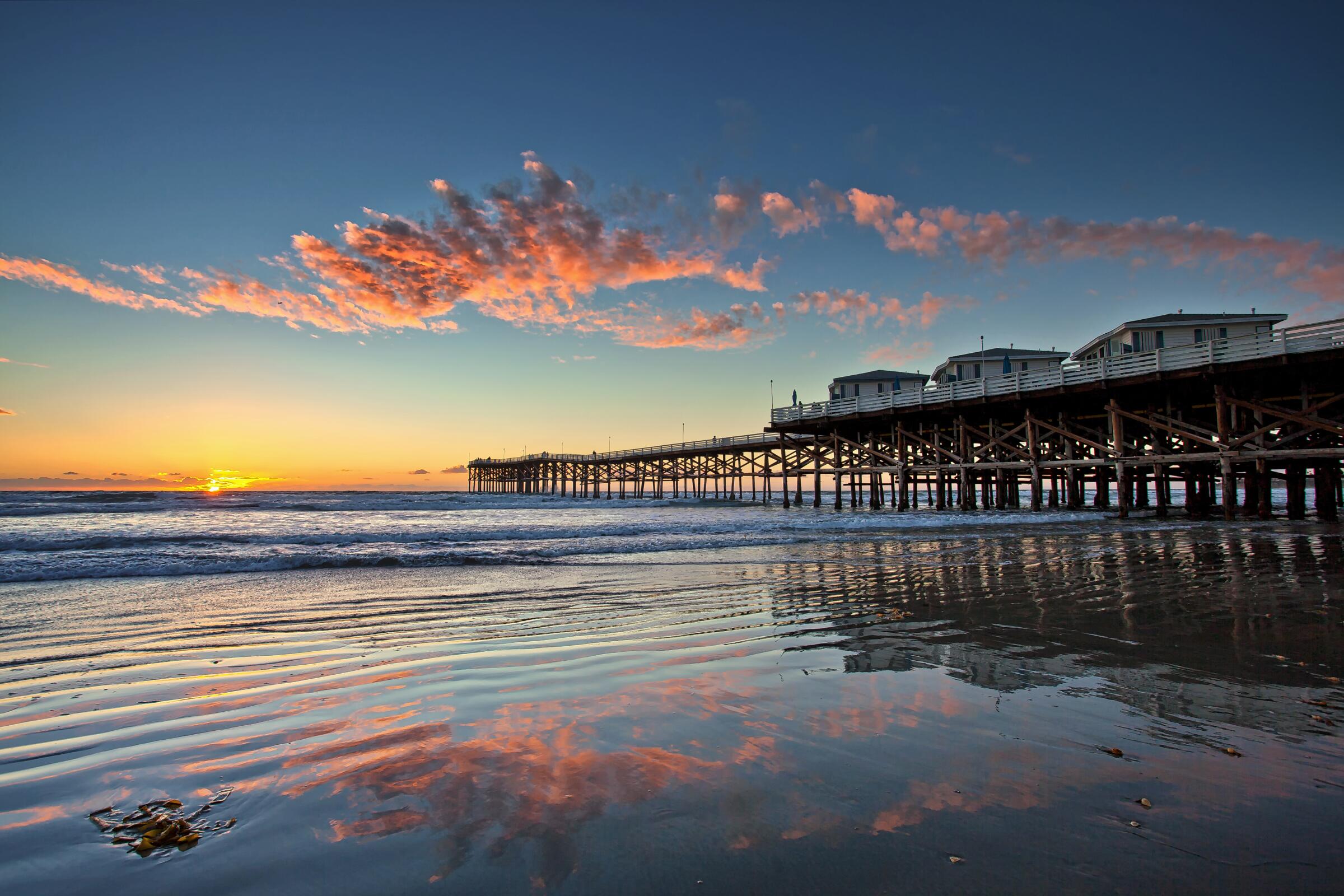 Bungalows on a pier at dusk; Crystal Pier; Pacific Beach; San Diego, California. Taken 9 November 2015.