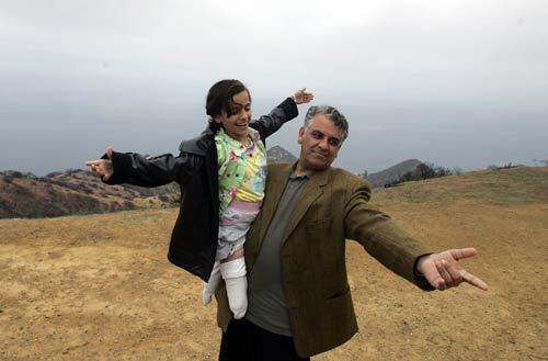 Salee Allawe, a 10-year-old Iraqi girl who lost both legs last year in what her family said was a U.S. air strike on the outskirts of Baghdad, and her father, Hussein Allawe Feras, show their joy during a visit Monday to Santa Catalina Island. Salee recently was fitted with mechanical knees and prosthetic limbs at the Shriners Hospital for Children in Greenville, S.C. Her sponsors wanted to give her a happy memory before she returns to her war-torn country next week, so she was taken on a daylong tour of the island. Also killed in the attack were Salee's 13-year-old brother and her best friend .