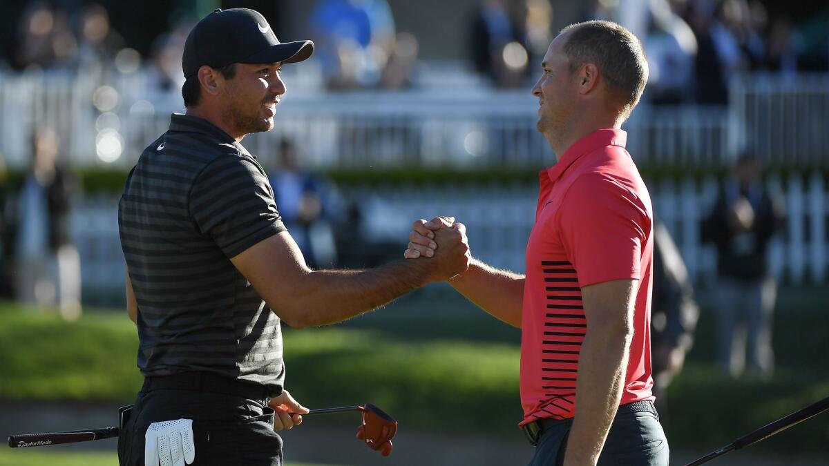 Jason Day, left, shakes hands with Alex Noren after winning the Farmers Insurance Open following their sixth playoff hole Monday at Torrey Pines South.