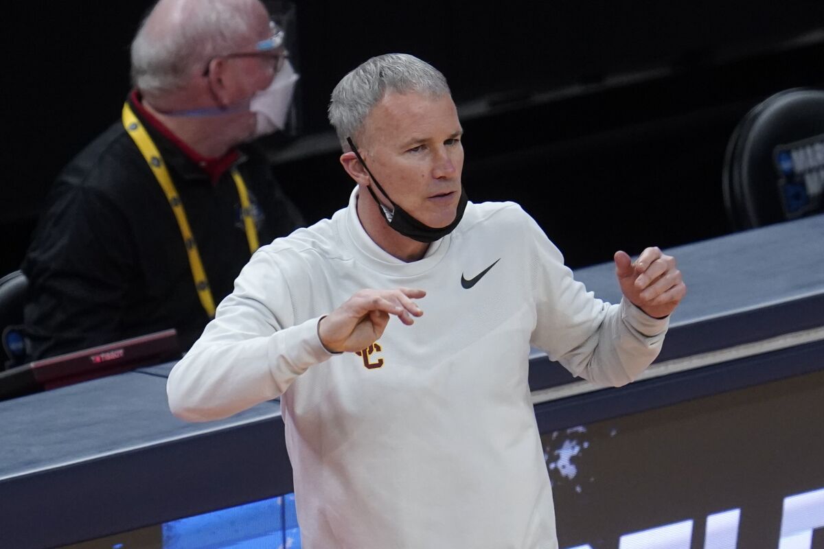 USC coach Andy Enfield watches play against Drake during the second half March 20, 2021. 
