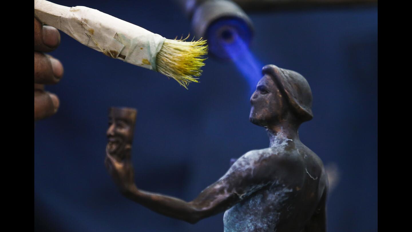 "The Actor" is heated and coated with a chemical to give the bronze statuette a patina at the American Fine Arts Foundry in Burbank. The Actor will be presented at the SAG awards show on Jan. 30th.