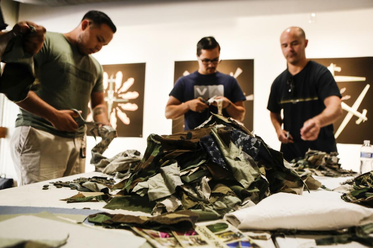 Artist Drew Cameron leads a workshop, "Combat Paper," based on his work with veterans.