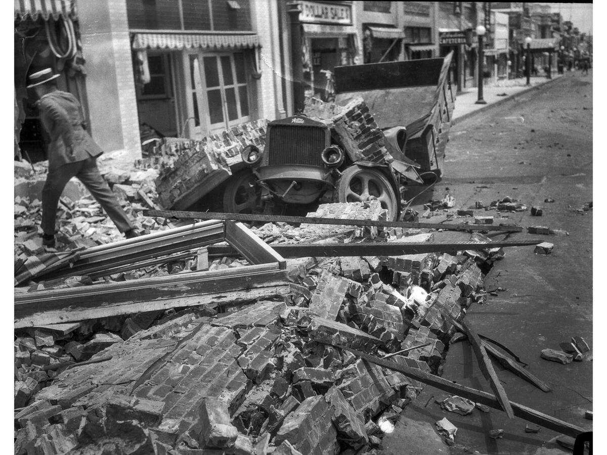 June 29, 1925: Truck crushed by falling brick walls on State Street in Santa Barbara following the 6.8 earthquake.
