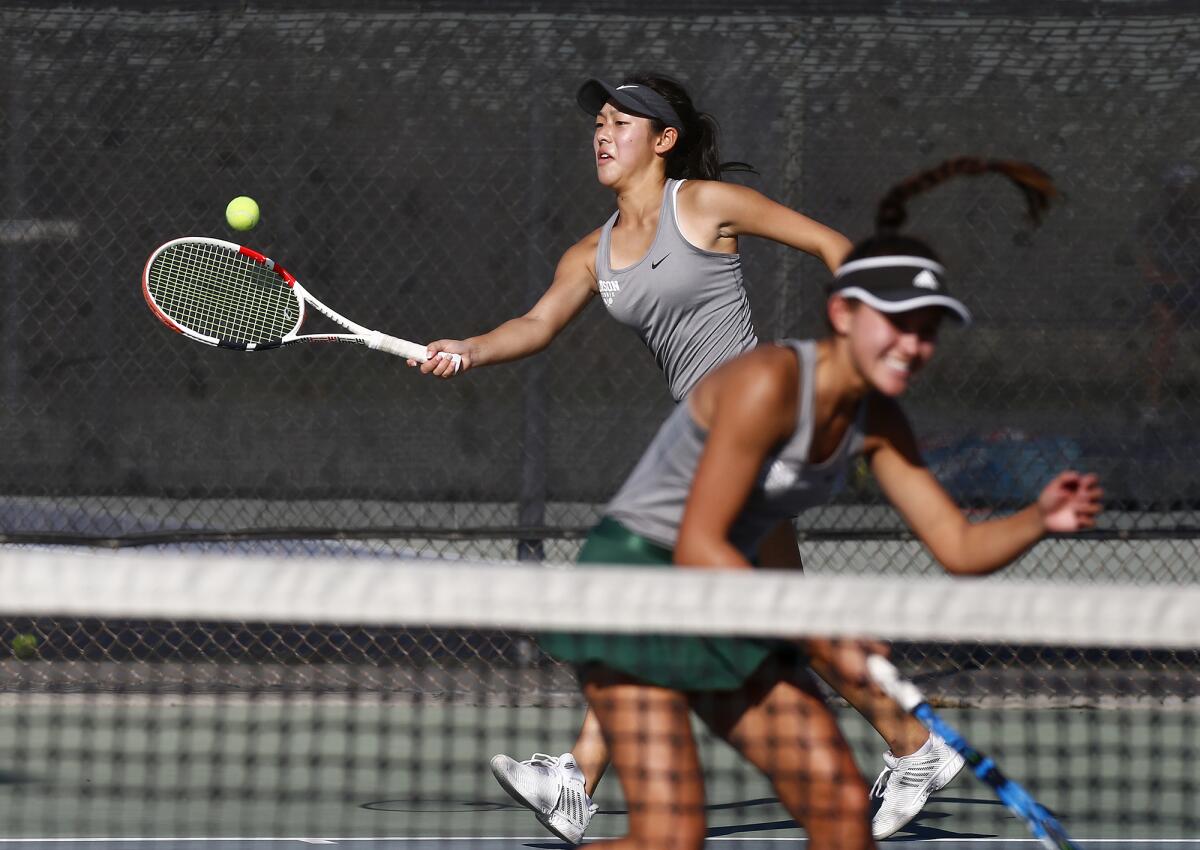 Edison doubles players Kaylee Hseih, top, and Kailee You during the CIF Individuals tournament on Wednesday.