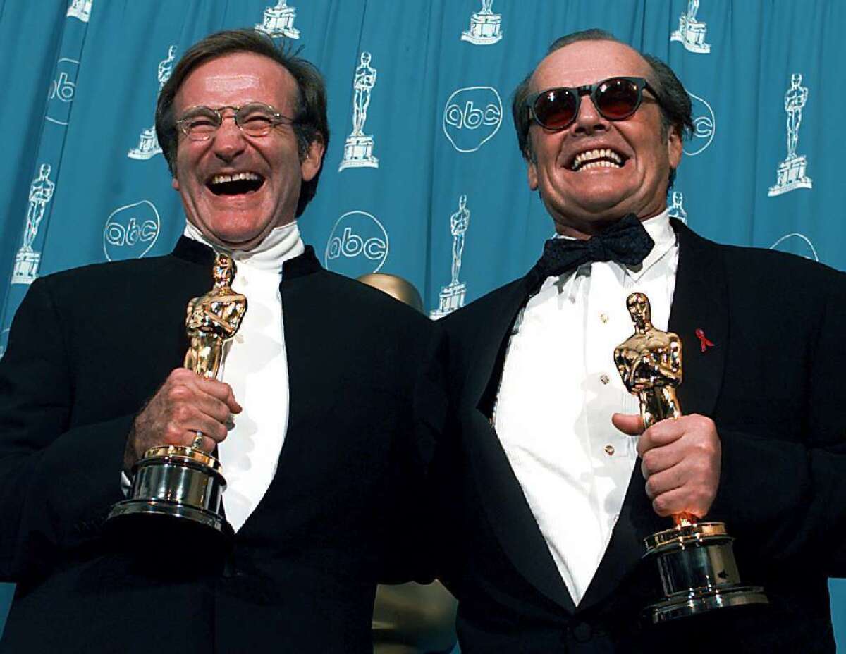 Robin Williams and Jack Nicholson are all smiles with their Oscars in 1998.