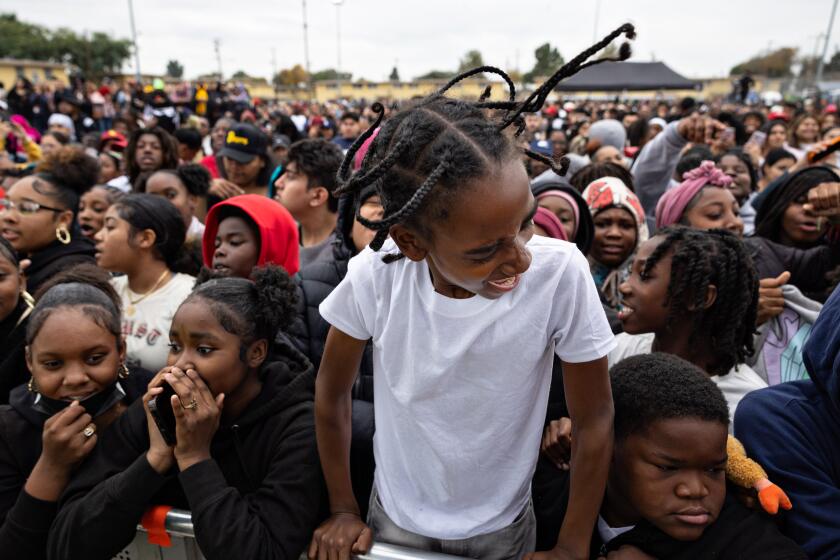 Los Angeles, CA - December 19: Hundred of kids and community members enjoys Top Dawg Entertainment's (TDE) 10th annual toy drive and concert featuring SZA, Jay Rock, YG and other TDE artists in the Nickerson Gardens housing projects on Tuesday, Dec. 19, 2023 in Los Angeles, CA. (Jason Armond / Los Angeles Times)