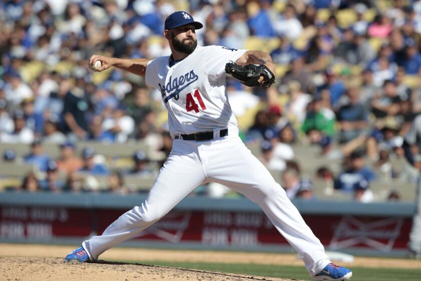 Chris Hatcher is pictured on opening day, when he picked up the save in a 6-3 victory over San Diego. But he has had his struggles, going 1-4 with a 6.38 earned-run average.