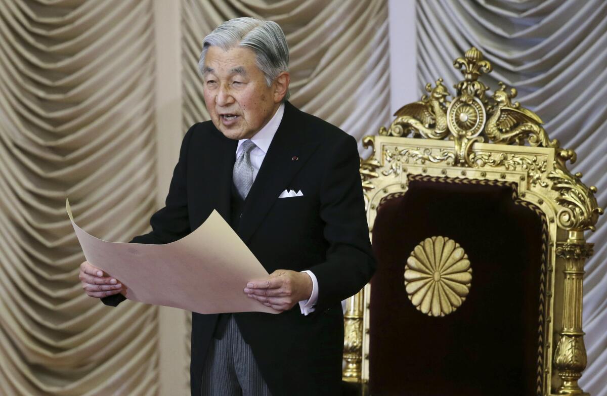 Japan's Emperor Akihito reads a statement to formally open the extraordinary Diet session at the upper house of parliament in Tokyo on Aug. 1.