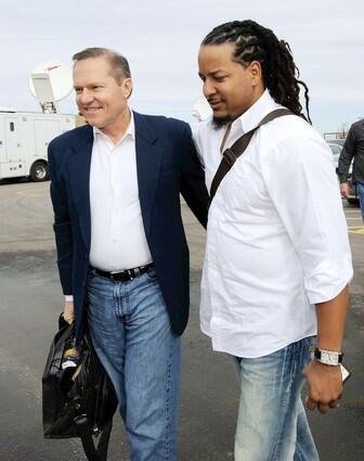 Manny Ramirez arrives in Arizona with agent Scott Boras after the two finalized a two-year, $45-million contract with the Dodgers on Wednesday.