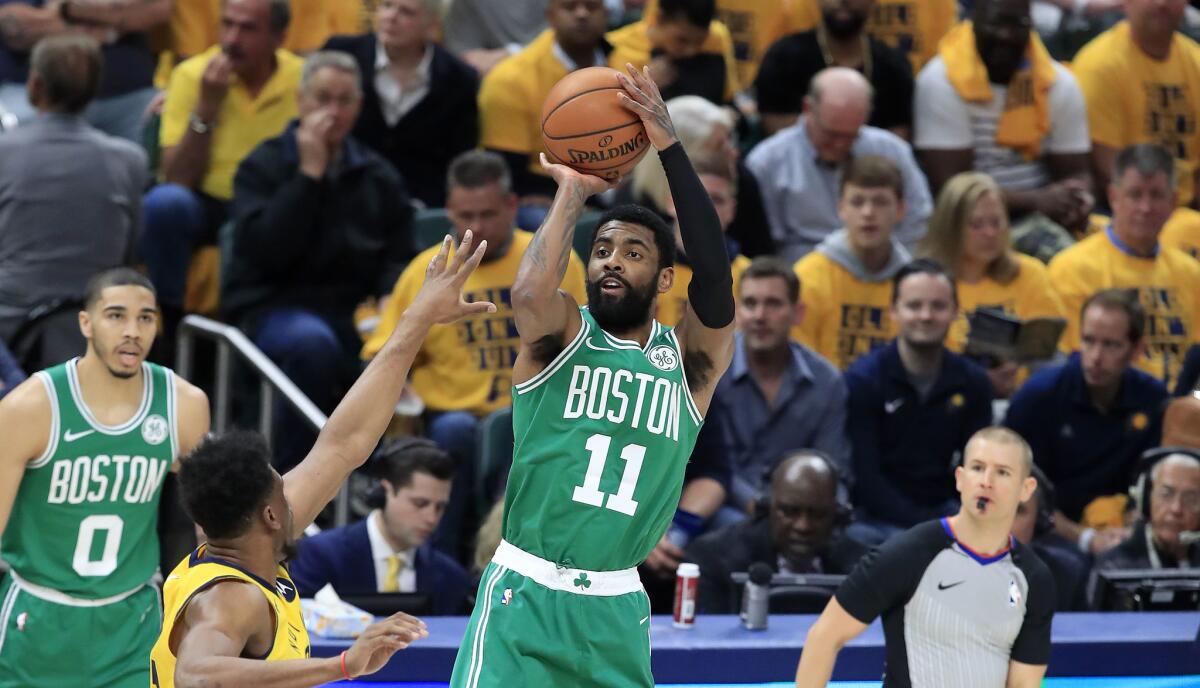 Kyrie Irving (11) of the Boston Celtics shoots against the Indiana Pacers.