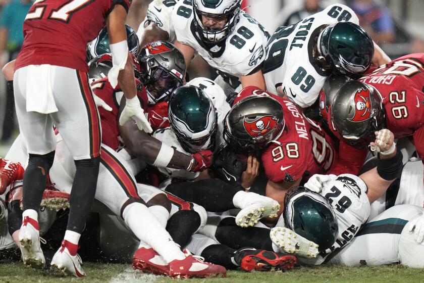 Philadelphia Eagles' Jalen Hurts, center, scores a touchdown during the second half of an NFL football game against the Tampa Bay Buccaneers, Monday, Sept. 25, 2023, in Tampa, Fla. (AP Photo/Chris O'Meara)
