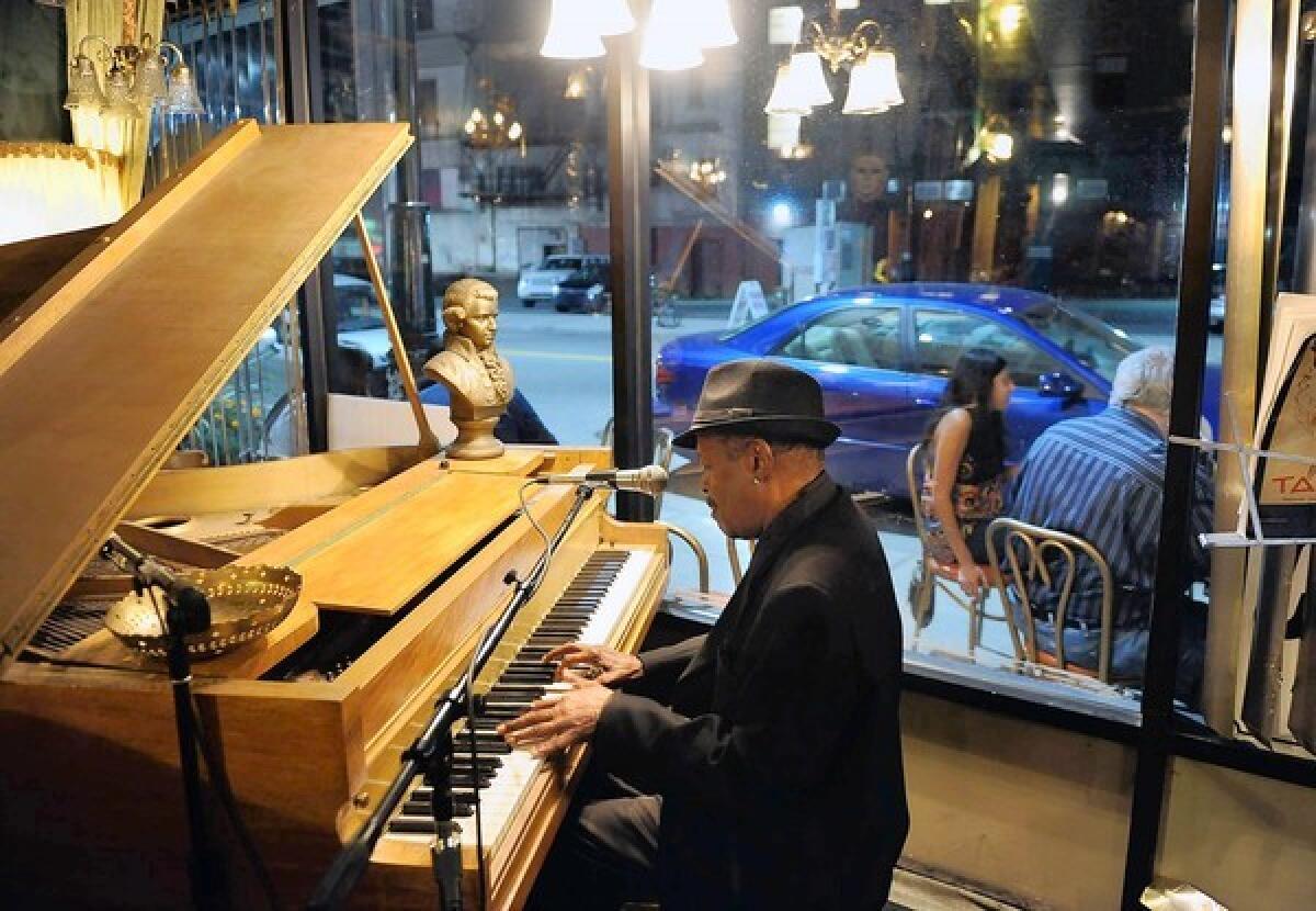 A pianist tickles the ivories at Café D’Mongo’s, a speak-easy that has reopened thanks to downtown Detroit’s growing revitalization.