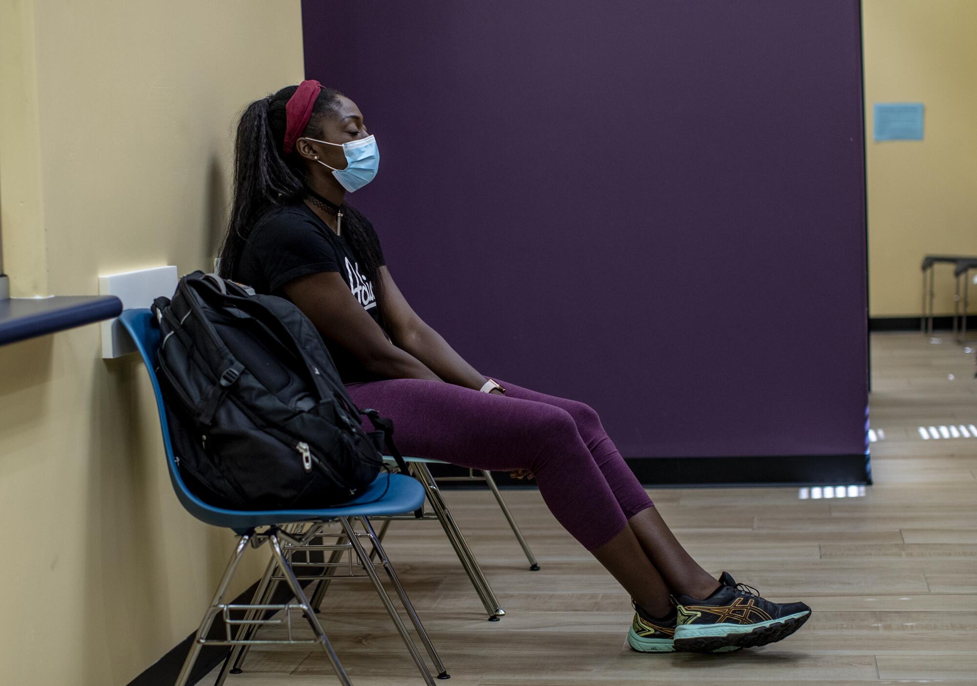 A woman sitting in a waiting room