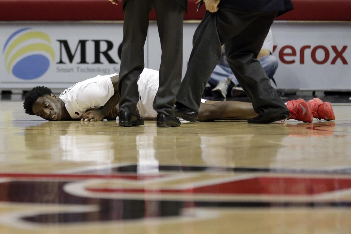 San Diego State forward Dwayne Polee II lies on the court after collapsing.