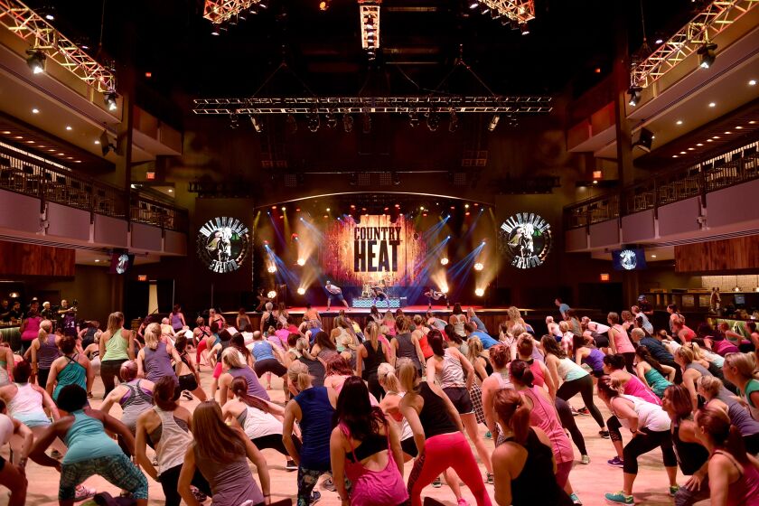 NASHVILLE, TN - JULY 29: Super Trainer Autumn Calabrese teaches COUNTRY HEAT at the 2016 Beachbody Coach Summit in Nashville at the Wildhorse Saloon Honky Tonk on July 29, 2016 in Nashville, Tennessee. (Photo by John Shearer/Getty Images for Beachbody)